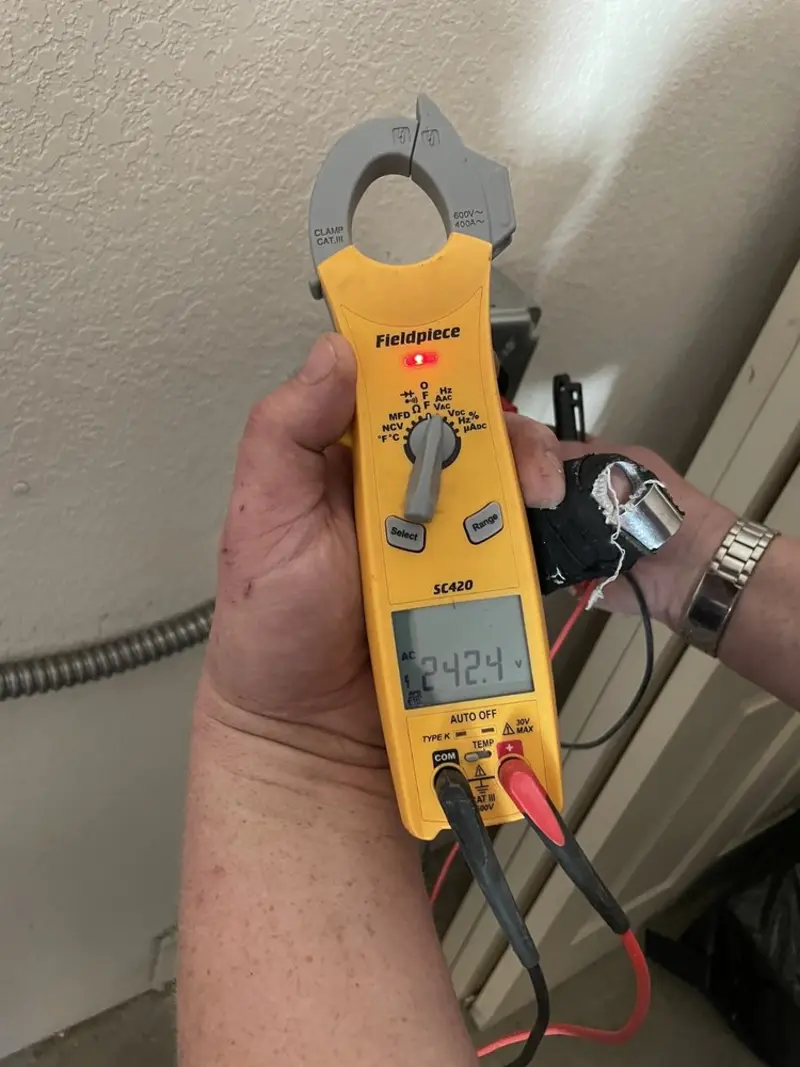Voltage testing with clamp meter during Electrical Installation Services in Auburn Hills